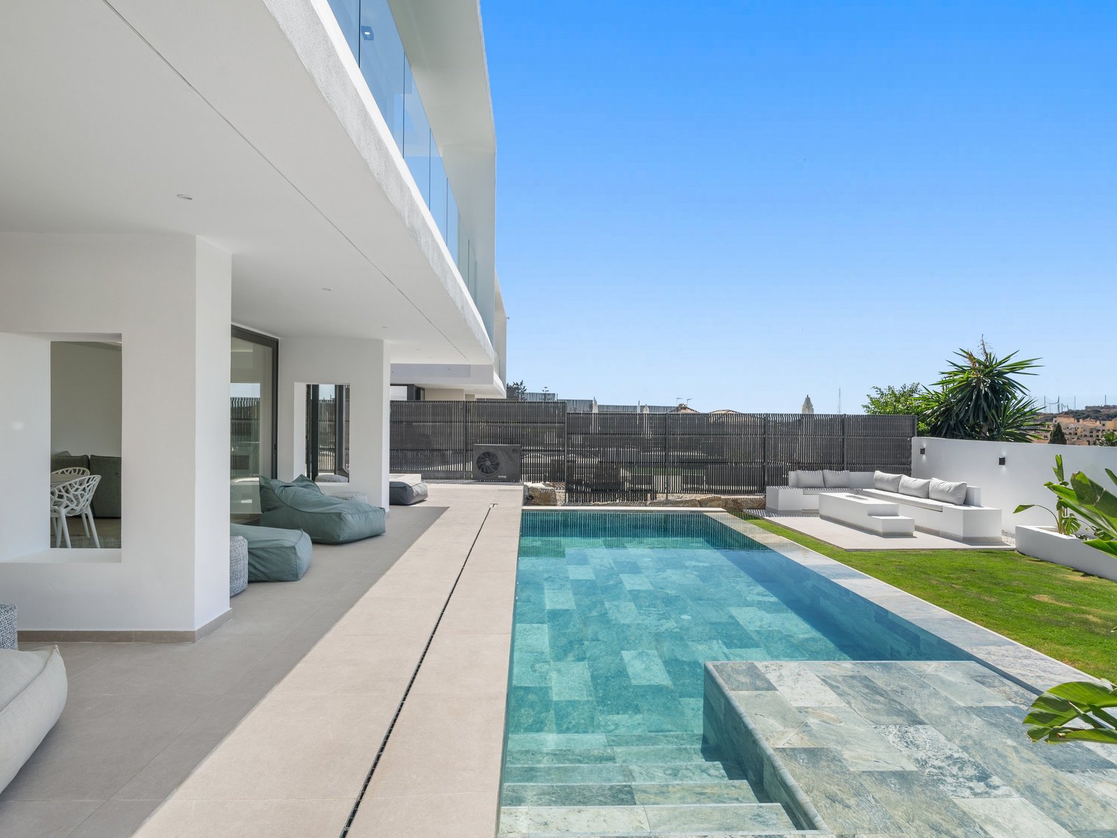 Pool and terrace seen from the covered porch